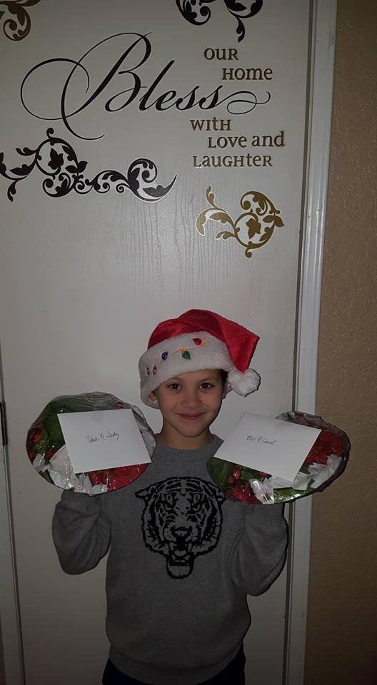 Ready to deliver Christmas cookies to our neighbors. Who could resist that smile?