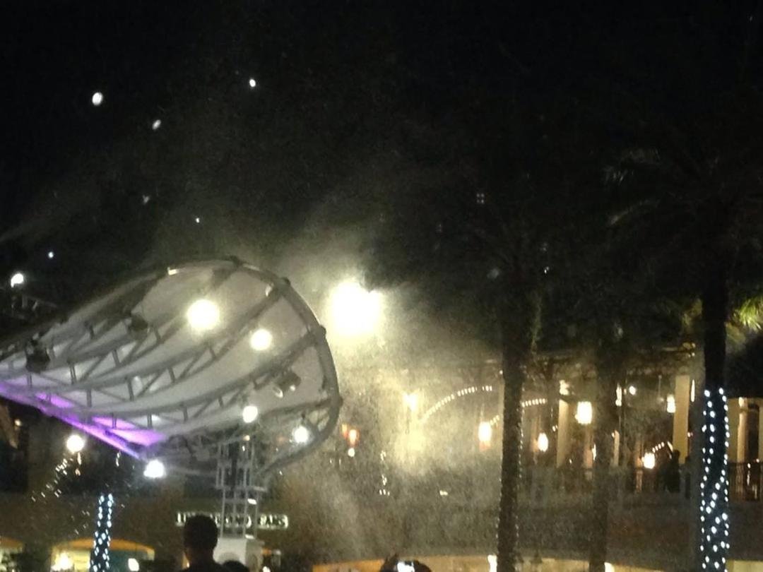 Out to dinner and dancing with Riana at city place in Palm Beach having a great time when it started to snow.