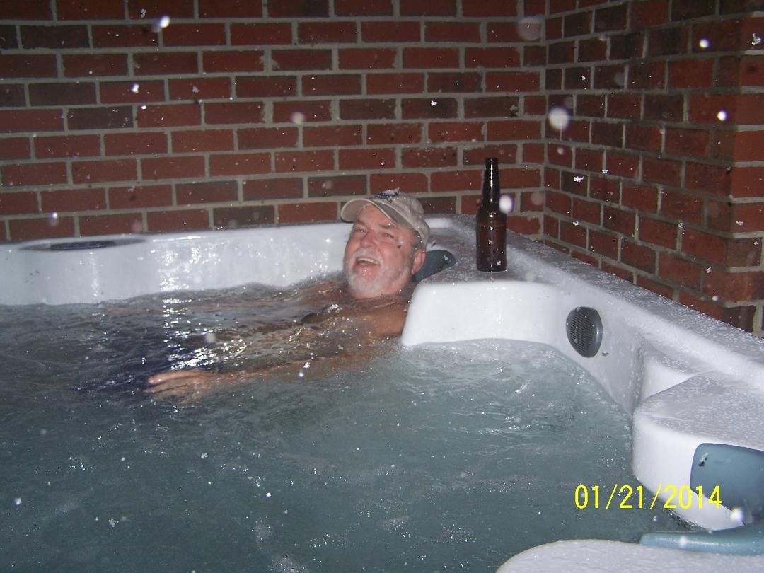 Finally got Jerry's pic on here, hot tub in the snow,had to have his hat! Last week when it snowed!