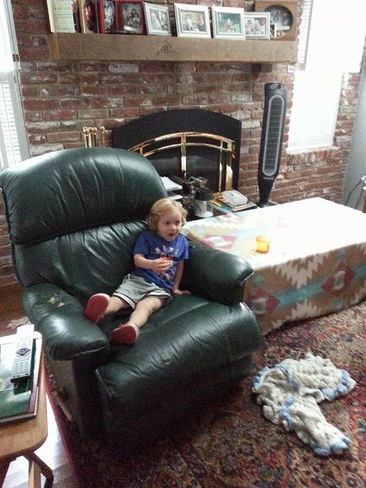 Relaxing in Grandpa's chair watching "Tao The Little Bus" & eating cherry tomatoes
