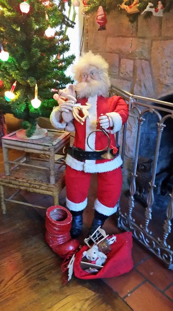 This is the wonderful Santa that my sister Lee made for me for my birthday many years ago. She sculpted the head, hands, and boots and made a canvas body for him. The tree behind him is a vintage bubble light tree. Merry