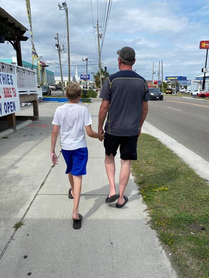 Even at 13, he is never to old to reach for his Dad’s hand.