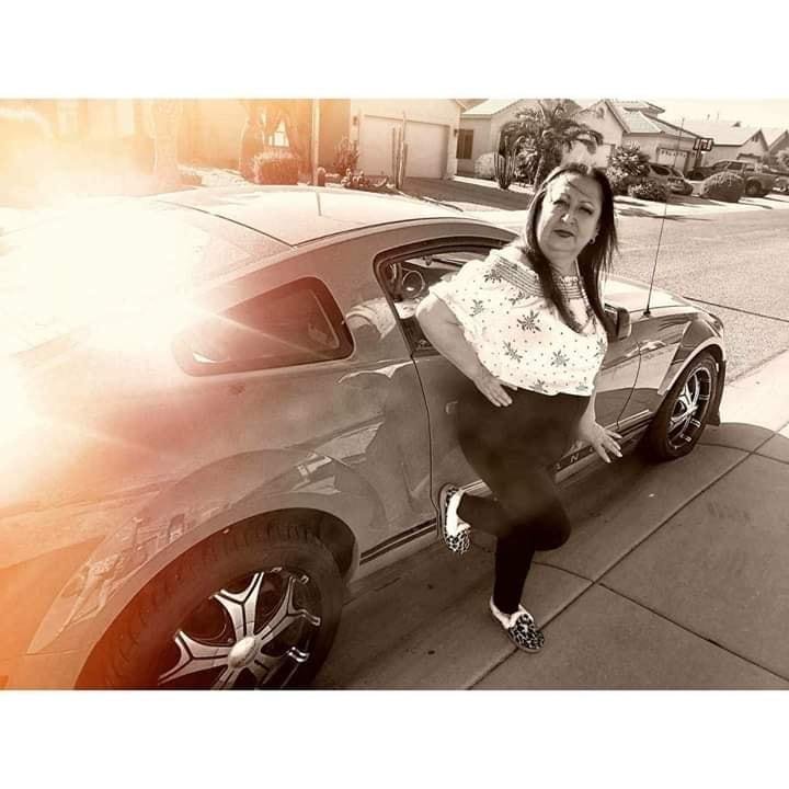 Straight hair, Jeffrey Starr makeup, standing next to my mustang