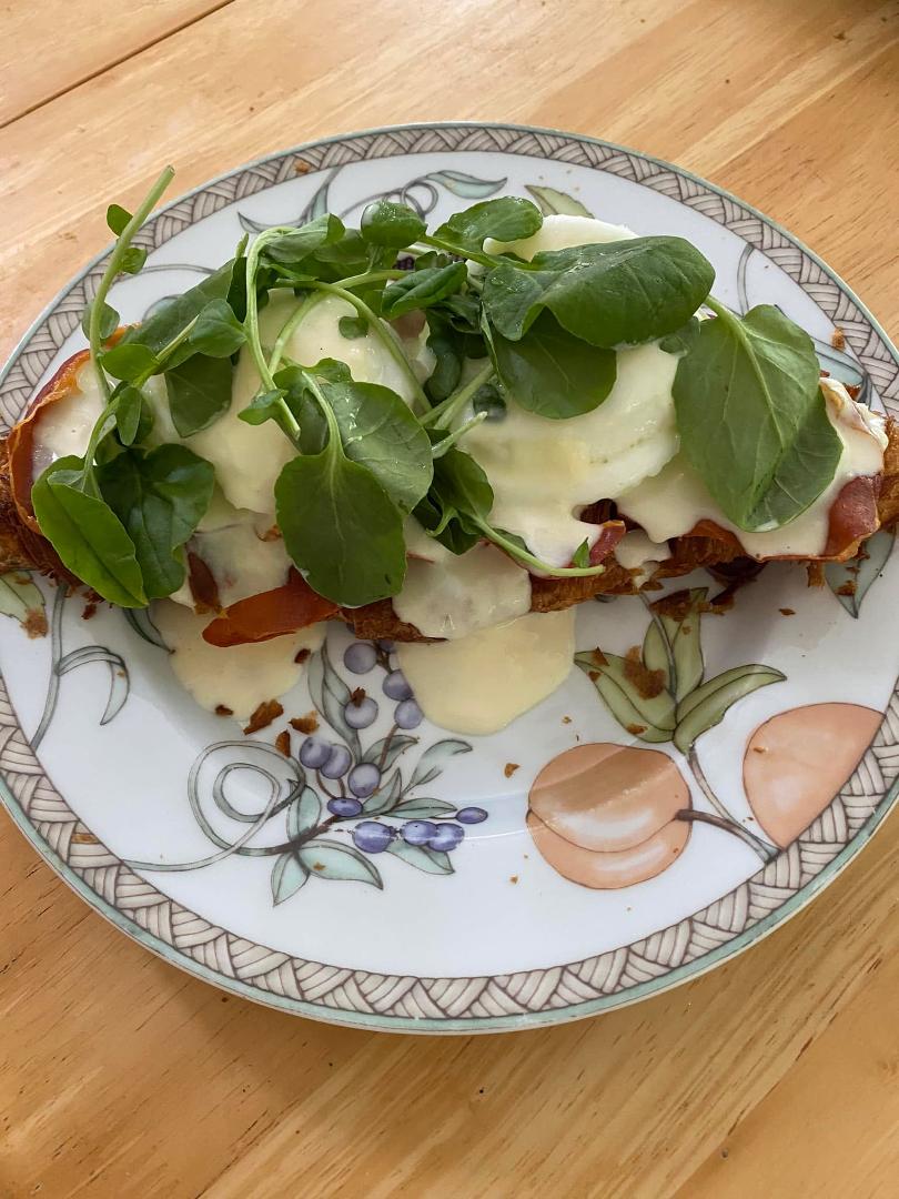 My breakfast creation. Eggs Benedict using a flattened croissant, crispy prosciutto, two poached eggs, hollandaise and watercress. Yum!