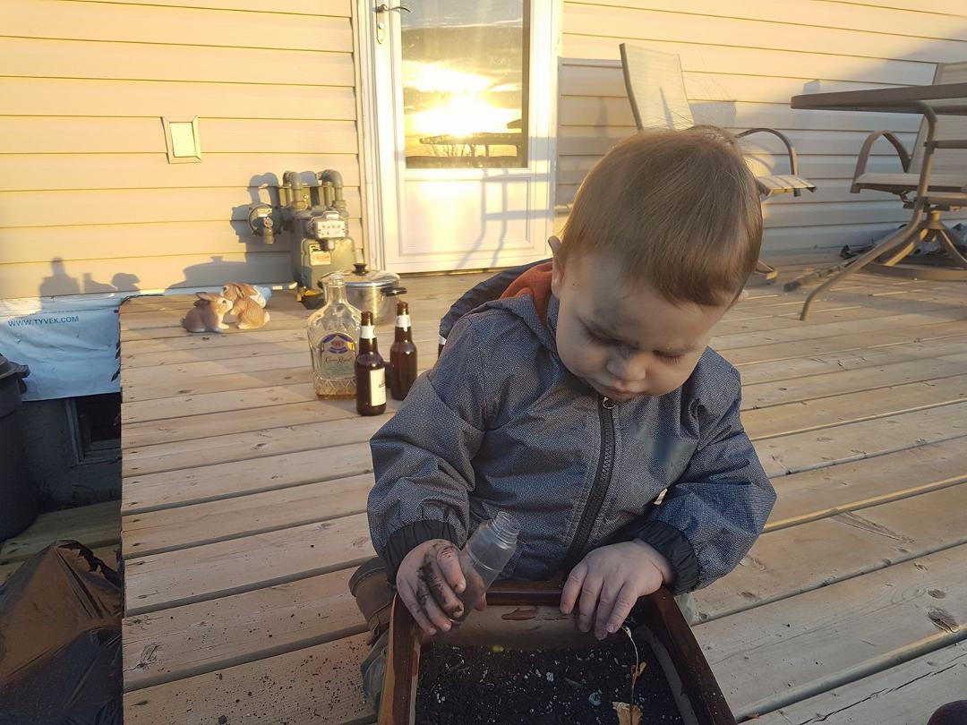 Grandpa says I can play in Moms flower pots as long as I get dirty 😲