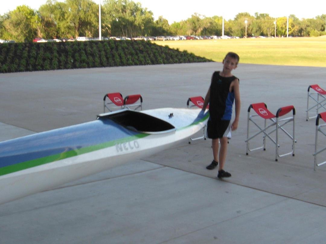 Alex with his kayak at Devon Center on the Oklahoma River.