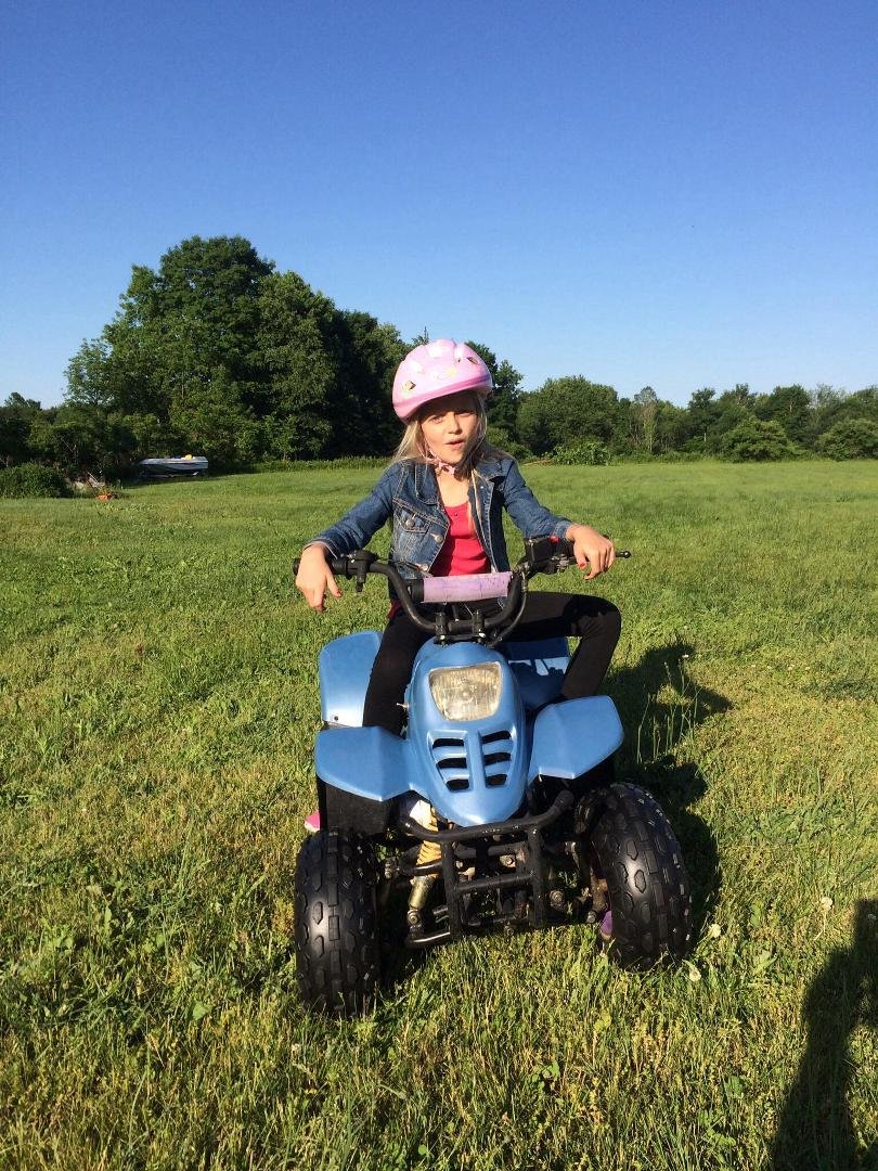 My Granddaughter riding her 4 wheeler