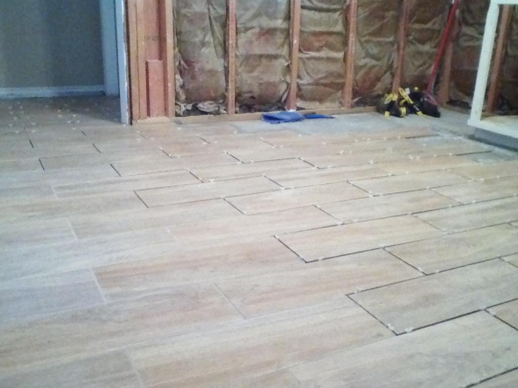 Laying the tile on the rest of kitchen. Ordered rest of cabinets. Almost there.