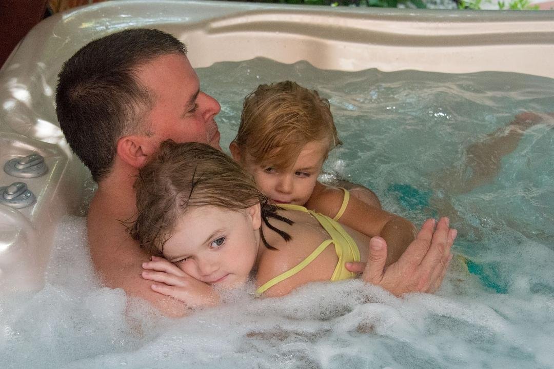 My son, Edward Overstreet with two of our grands, Lilyanne and Ella - from the pool to warm up, to the hot tub then back to the pool.