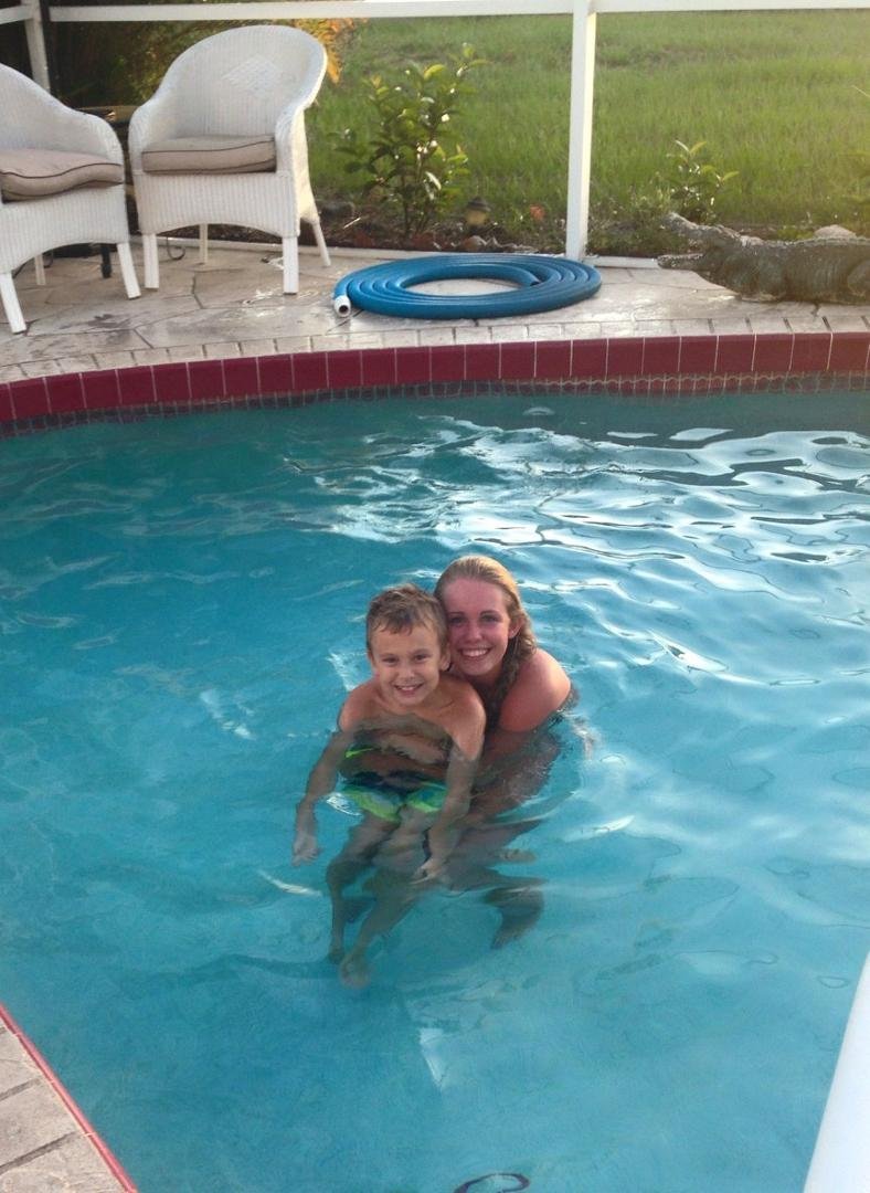 Kaylee and Nicholas having fun in the pool