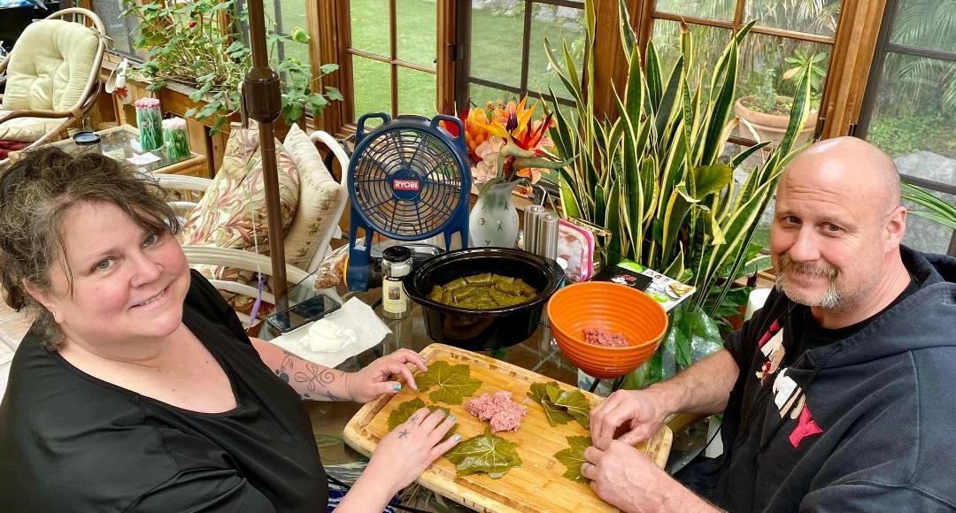 Michelle Herriott-Zierkeand Adolf Zierke making stuffed grape leaves for my birthday dinner…YUMMM