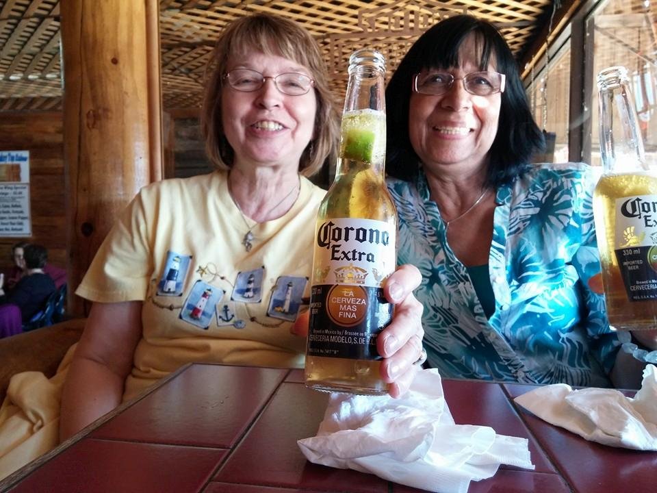 Danielle Leggatt and Celine Trudel enjoying a beer in The Monkey Top Saloon Bentley, AB