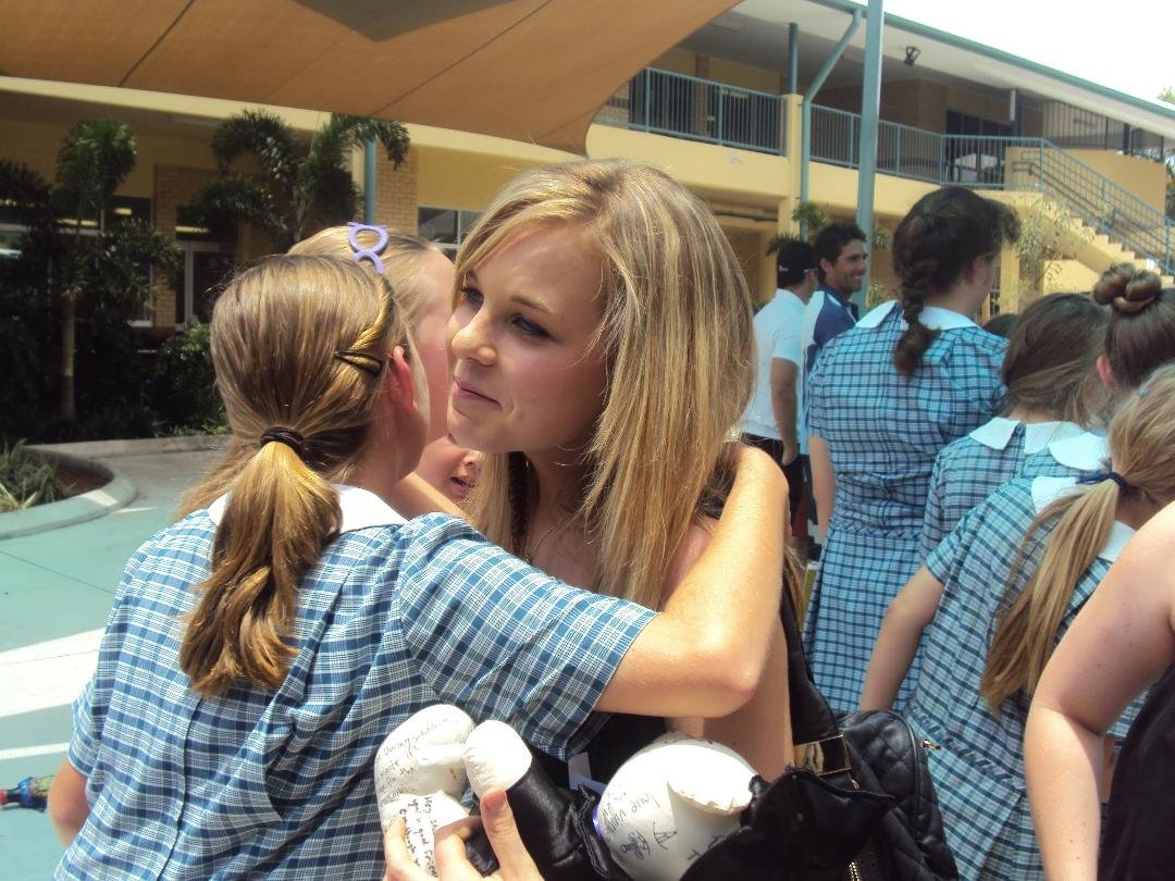 Little primary school girl saying goodbye very cute