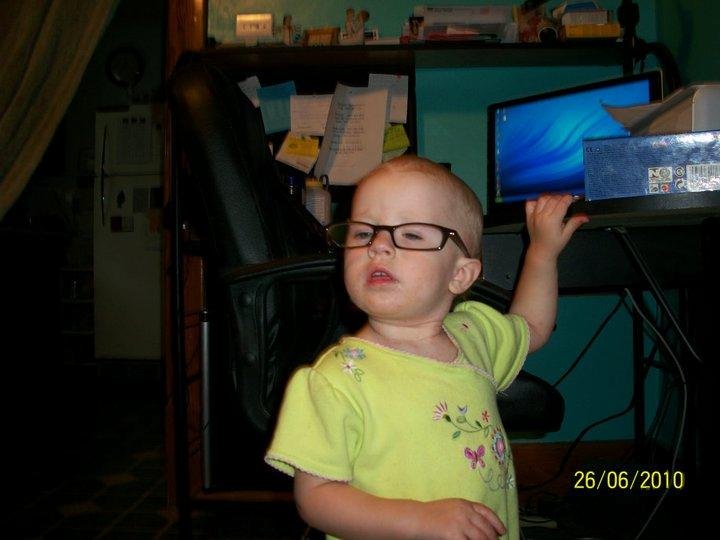 Sadie playing with Grandpas glasses