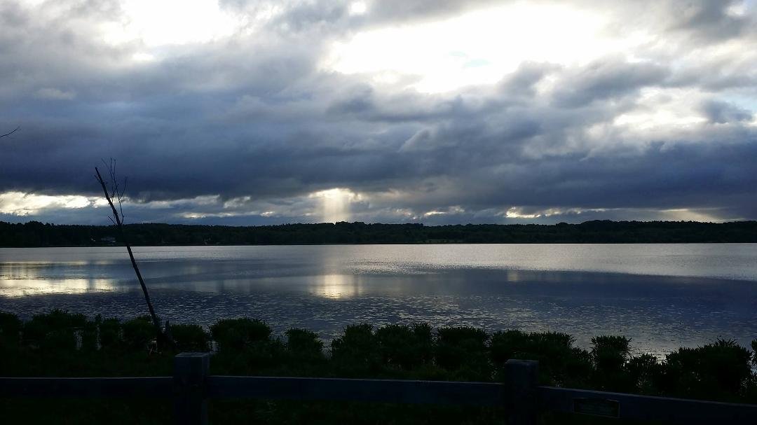Typical summer storm morning in upstate NY.
Morning sun breaking through storm clouds over Round Lake, NY 6am 6/9/2016. Temp 53°F.