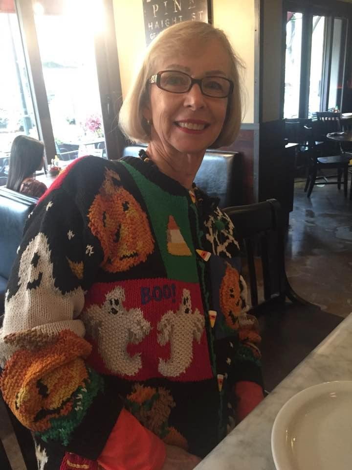 Cathleen in her Halloween Sweater at Patxis Pizza to watch the costumes. BOO !!!