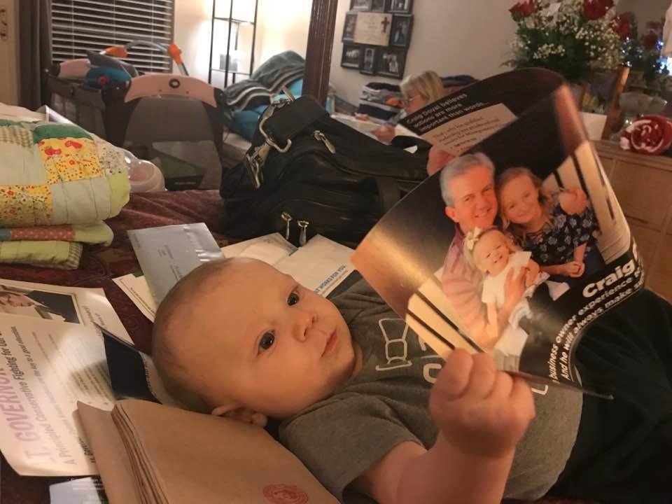 Our grandson is educating himself on the local races.