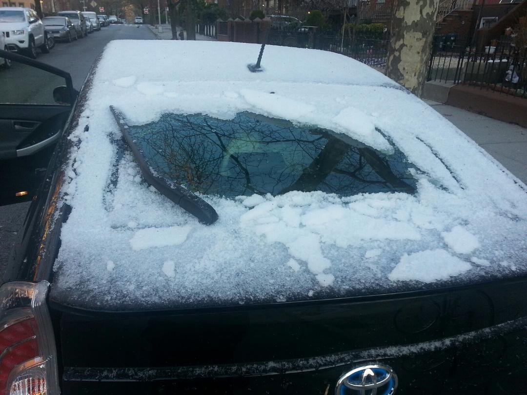 Trying to look through the rear window wondering where global warming is hiding.April 16 snow!!