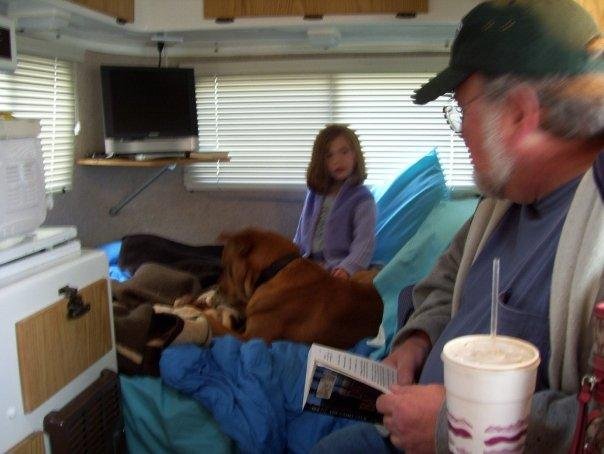 Buddy, granddaughter Julia and Bob in our Casita trailer.