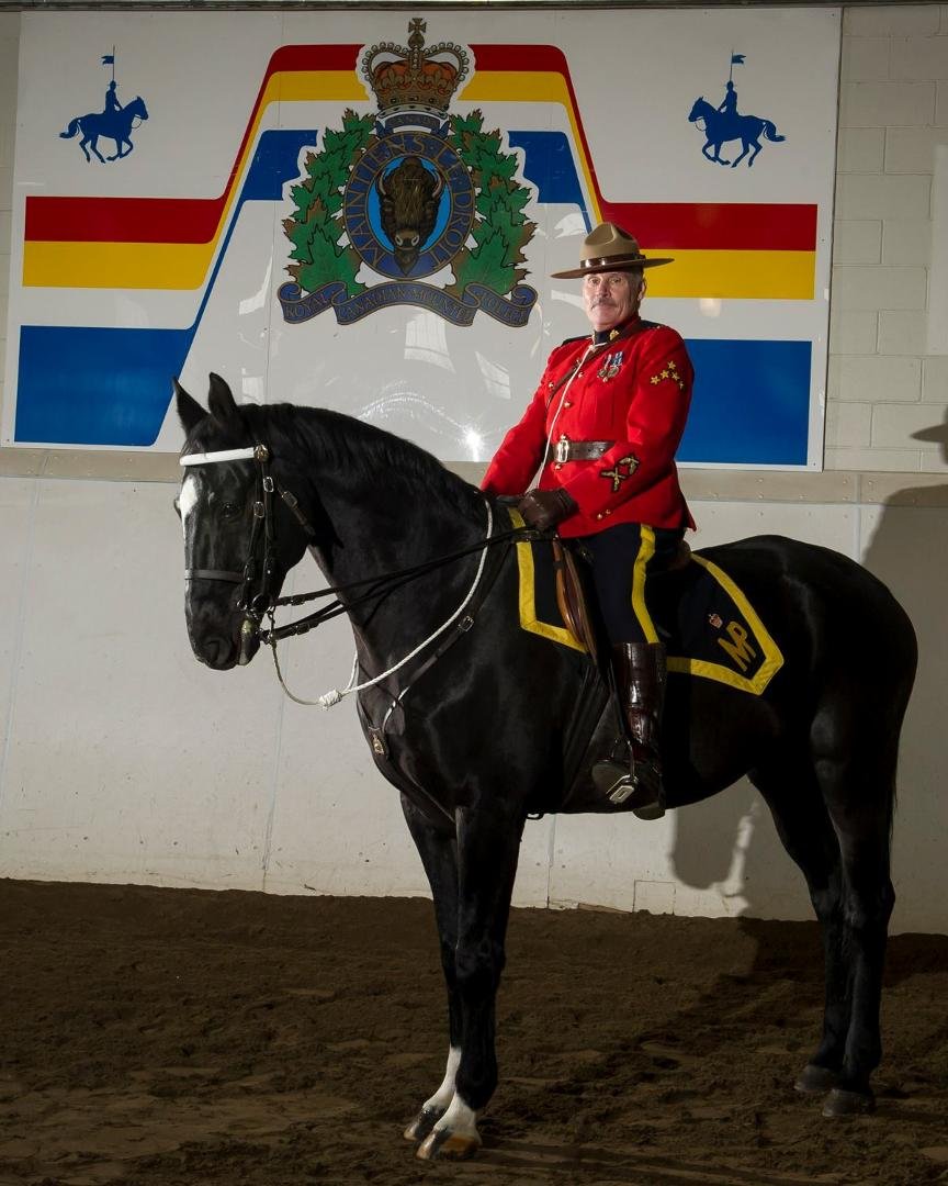 Graduation pic from basic Musical ride Course.   See I really can sit on a horse.