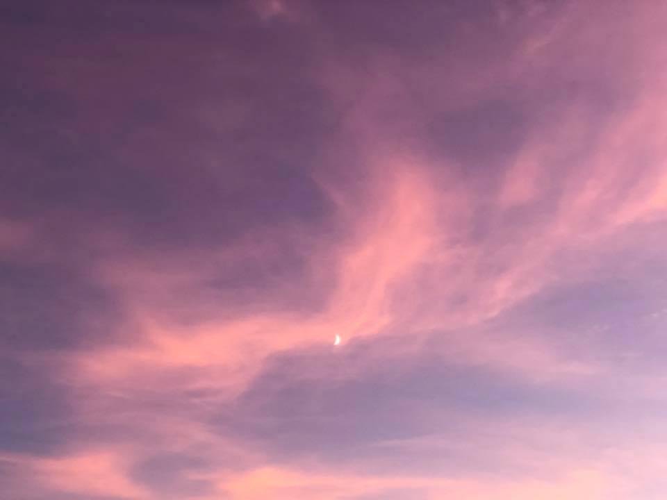 The moon as the sun sets,just thought it was kinda pretty.