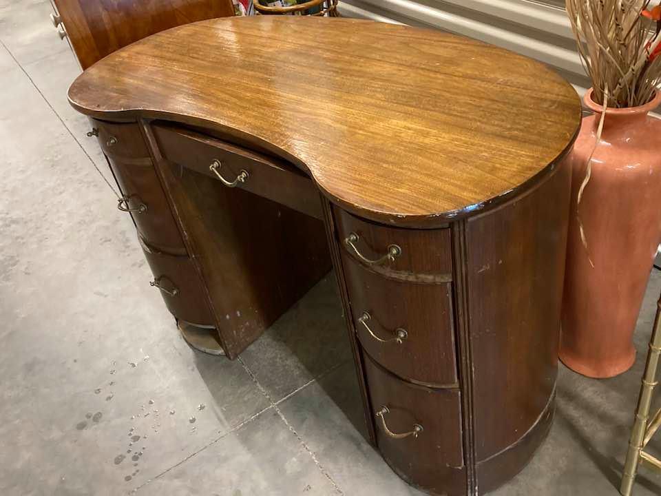 This is a half-moon desk with seven drawers. It was probably made in the 1920s. Asking $250 firm.