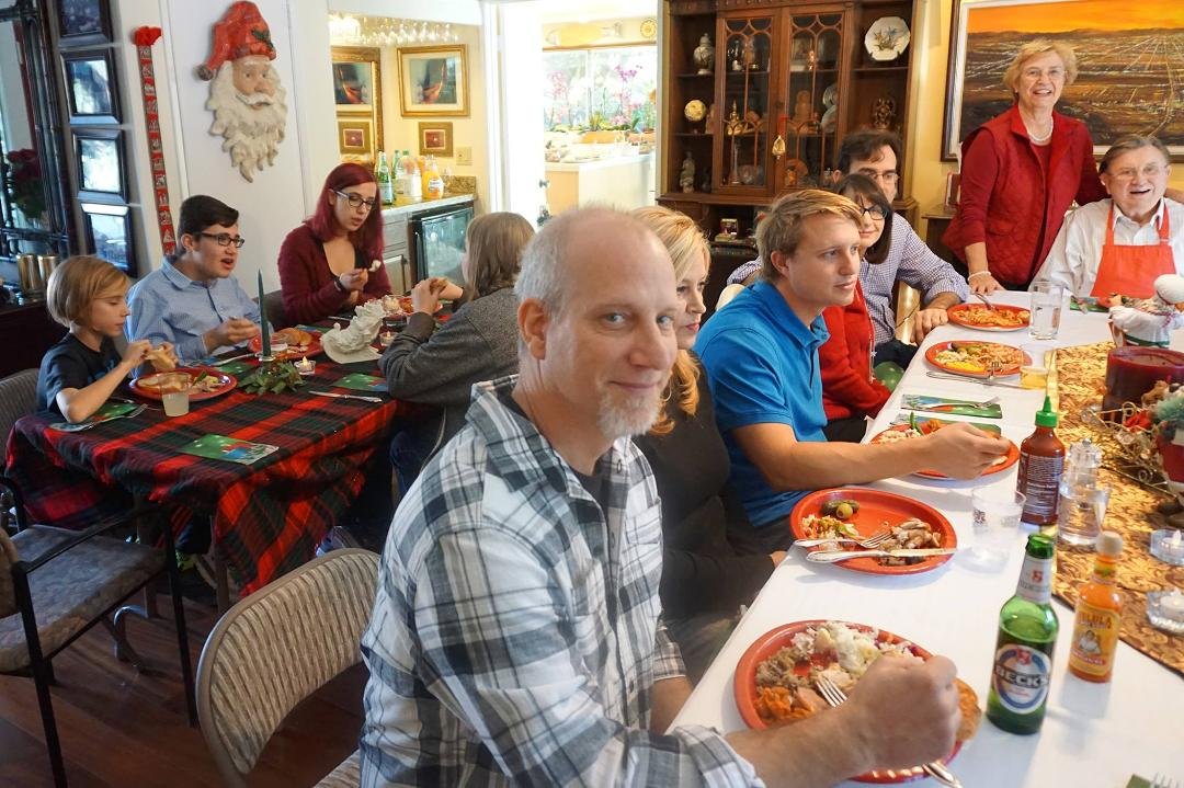 Traditional English Christmas turkey dinner with children and grandchildren