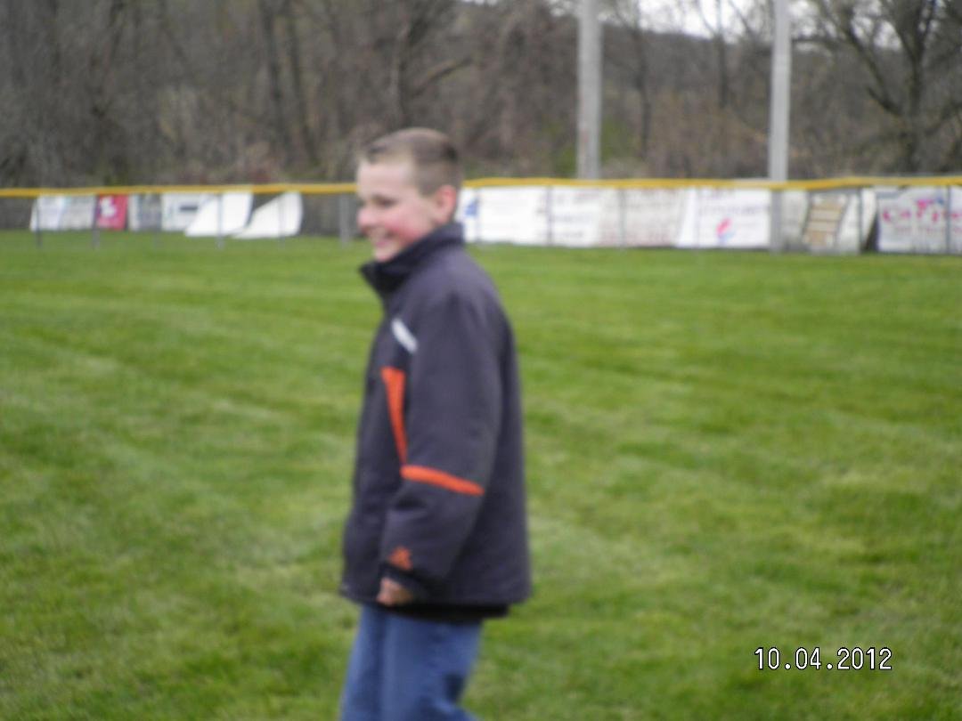 Grandma Miller playing kick ball with Isaac and Mattie