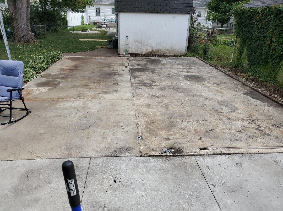 This is what my shop/garage looks like now.  Demolition was completed in 3 hours on Monday, something I had to wait 3 1/2 months to do. We're taking advantage of the bare slab to get our back yard tree trimmed, and construc