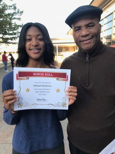 AAliyah was on the honor roll at her school. She is here with her father Gregory.
.