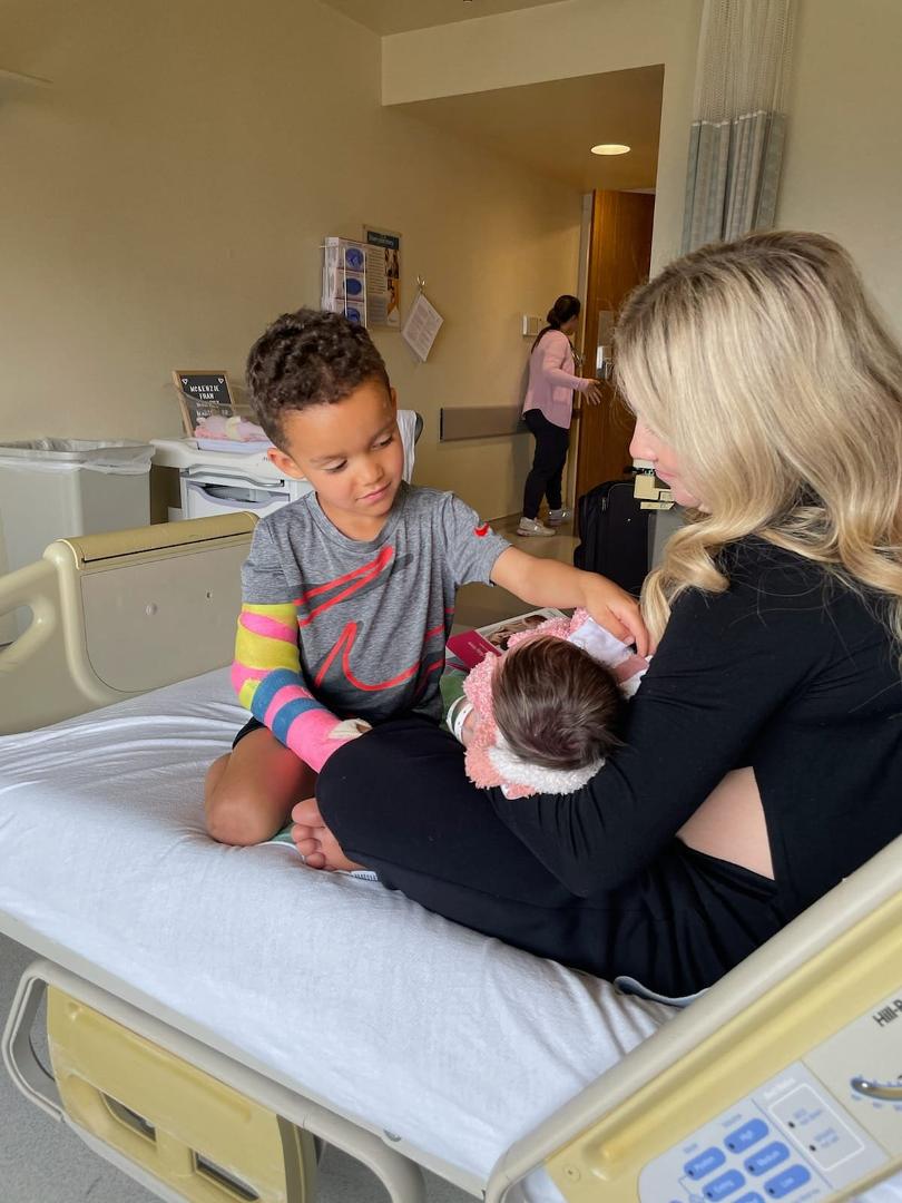My grandson meeting his new sister.