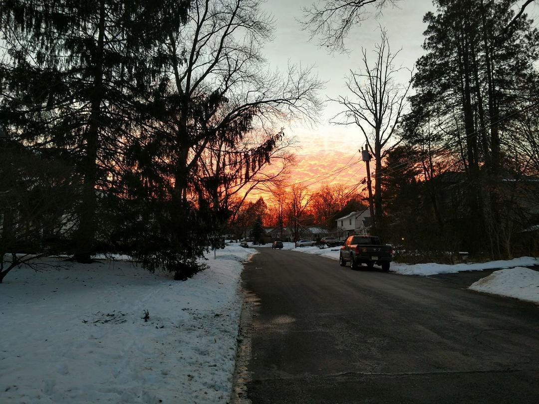 This makes me want to head west right now! 5:00 sunset down the street from me!