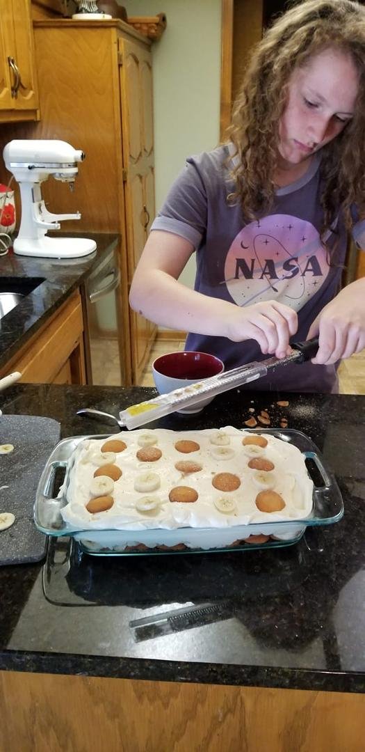 Greta my granddaughter making Banana  Pudding for dinner.  Loves to cook like Grammy.🥰