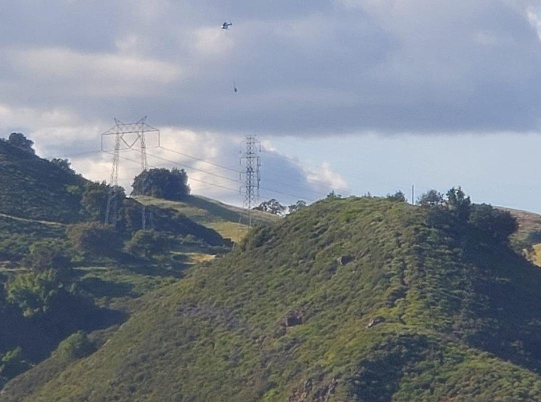 Heh Pamela Louise Fulmer is that Randy Fulmer dangling from the bottom of this copter? Tell him I waved!! Was in the white spec on the top lot just south of the tower they were working on today!!