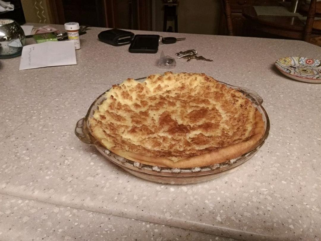 Well here is the delicious coconut custard pie. Couldn't wait for it to cool so we tried it fresh out of the oven. I only have three words for it. Good,good,good. Thanks Sandy Tracy for the post.