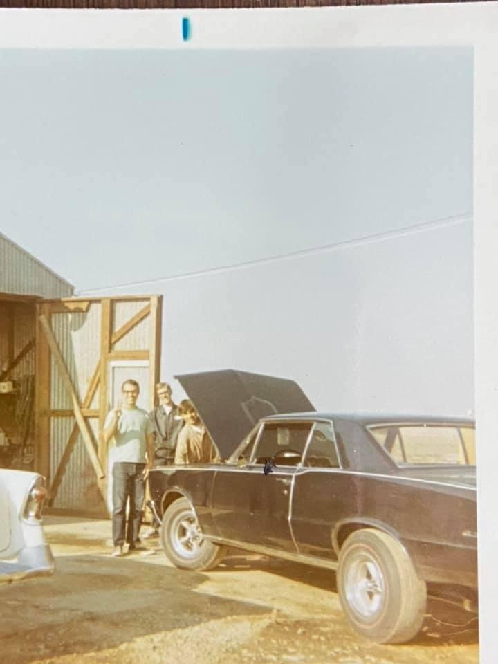 Working on the cars out at the shop on the farm. Doug Singer, Don Brown and Dennis Bastiao.