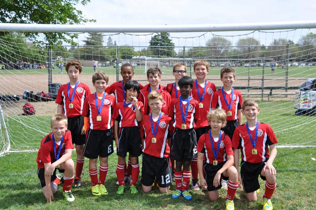 I spent the weekend at the El Palo Alto soccer tournament refereeing and coaching John's AYSO team. After 4 very well played games, our team won his bracket!