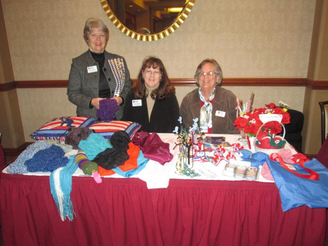 Eileen Johnson, Sharon Murphy and Norma Hayden working at the sales table.