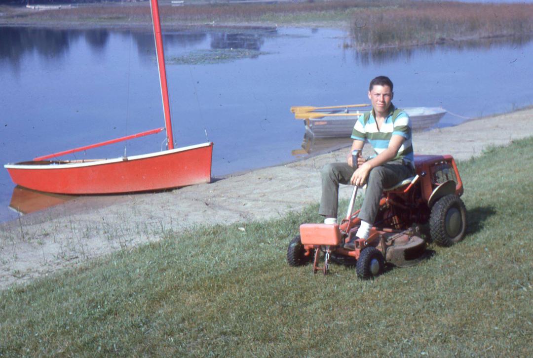 The good old days on Hammond Lake circa 1961. Me at 14, Simplicity lawn mower (we retired our 1936 Gravely walk behind tractor as pretty much worn out). Our 12' sailboat and 10' row boat.
