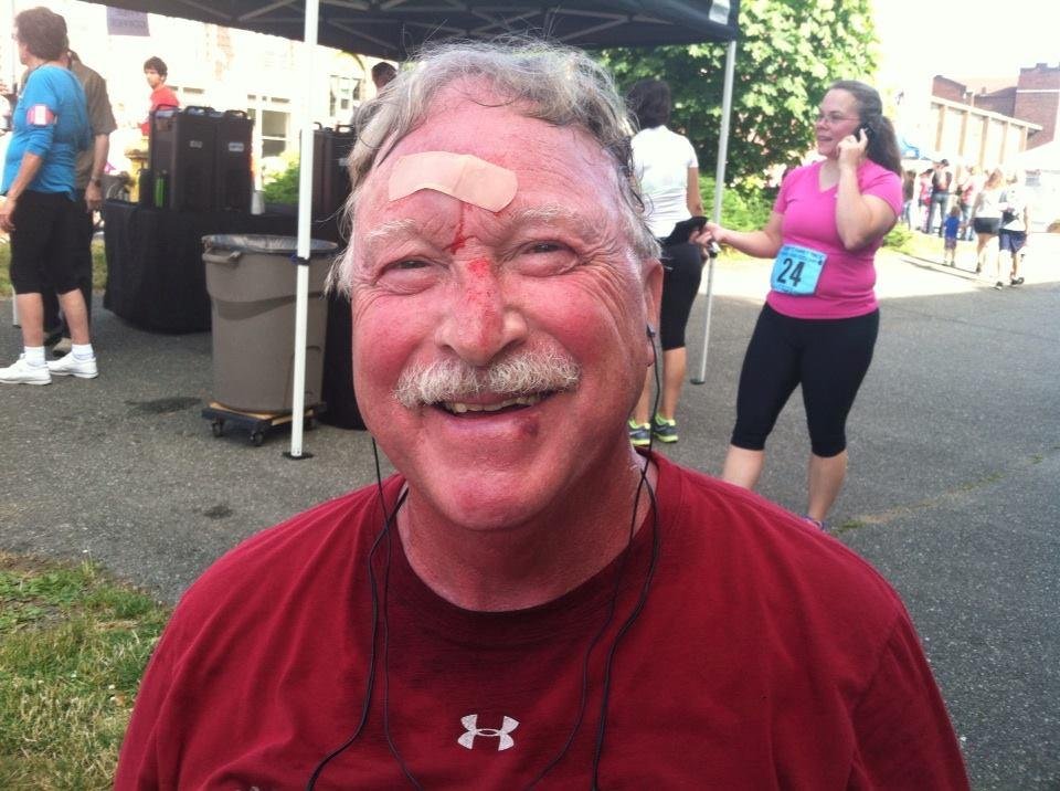 Face Plant! Scrapes and bruises! Small cut on forehead, but finished race in good shape! Tripped on a curb, Laurie! (Must be going around!) :)