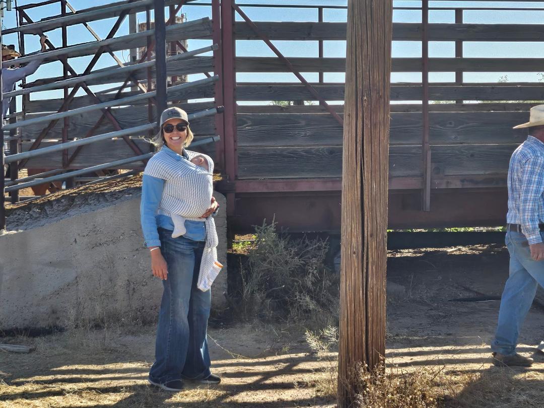 Meet Dally and her almost 3 month old son Krocket...this is how Cowgirls make Cowboys!!! Working at the chutes and sleeping through the commotion!!