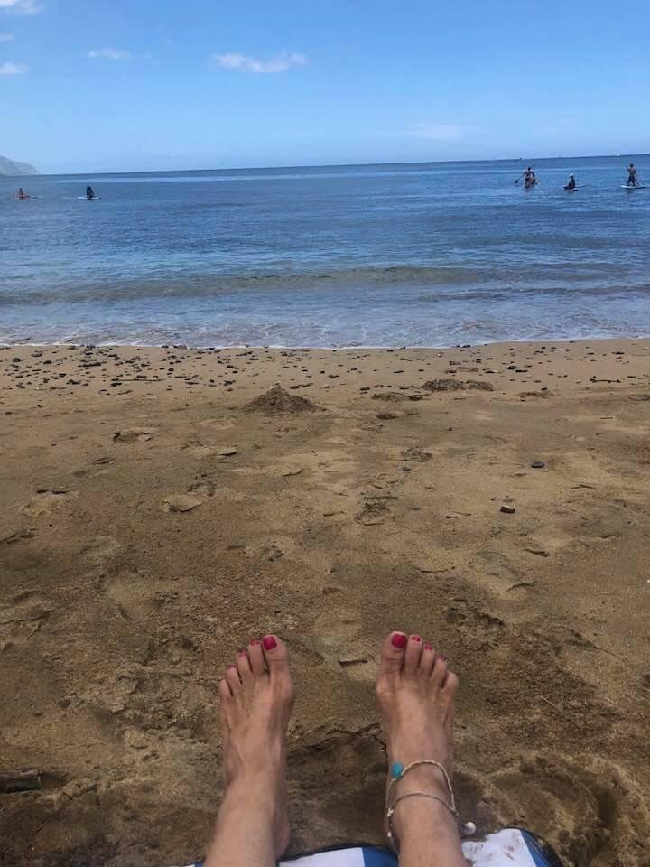 Sitting on the beach reading my book! Life is good!