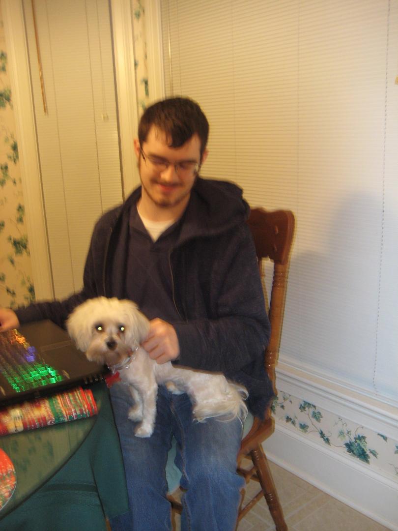 Meet our awesome grandson, Jeremy, with our Yorkie-Poo, Sophie!