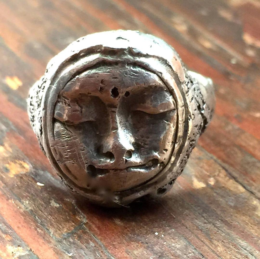 I REPAIRED THIS RING BY CREATING A NEW FACE FROM METAL CLAY. THE SOLDERING A BEZEL.