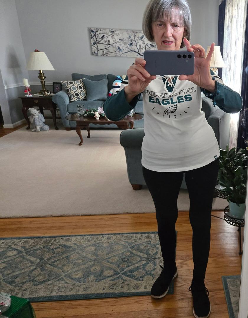 Playing on my phone while waiting for the Eagles game to start . Go Birds!