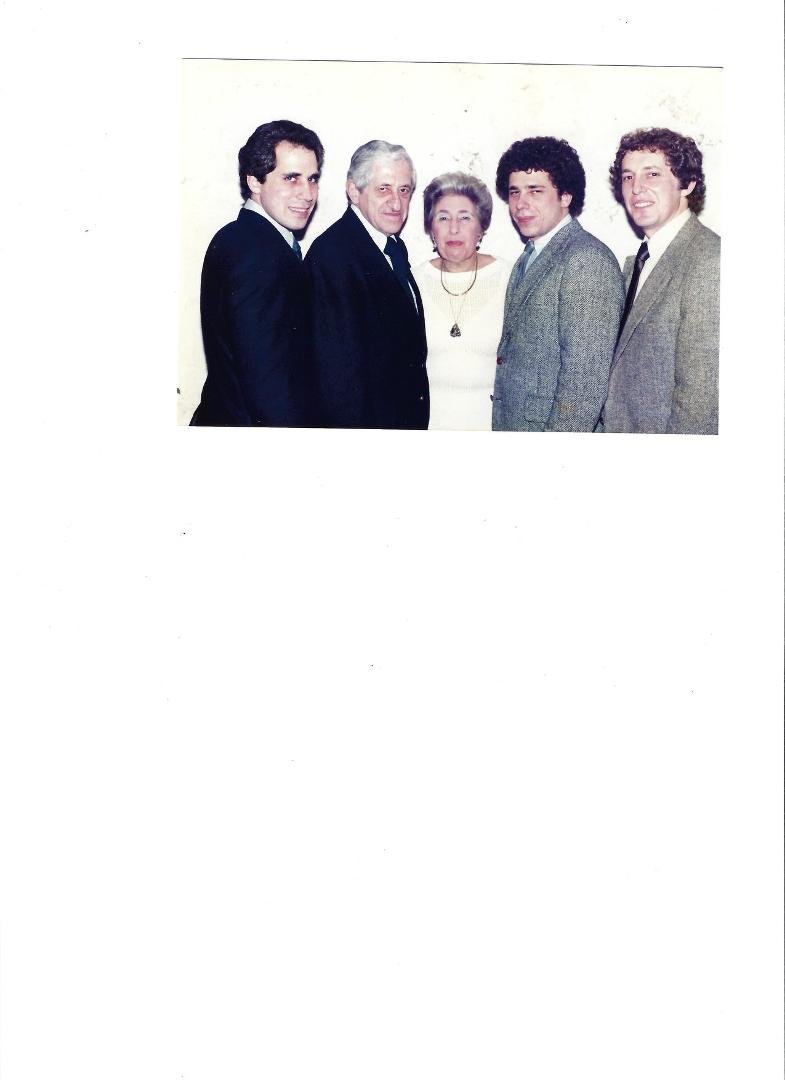 I post this picture in honor of my Dad's 100th birthday, which is today. Of course this picture was taken a long time ago and in happier times. It was at my maternal Grandmother's 85th birthday party. My Dad passed away