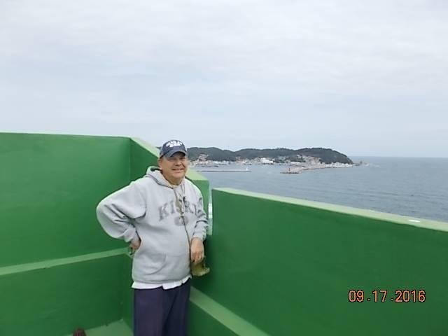 In a Kiski hooded sweatshirt no less, on the roof of a 15 floor condo on East Sea of Korea with sleepy village of Gaejin in background; and beyond that a little bit the lovely country of North Korea, may their people soon g