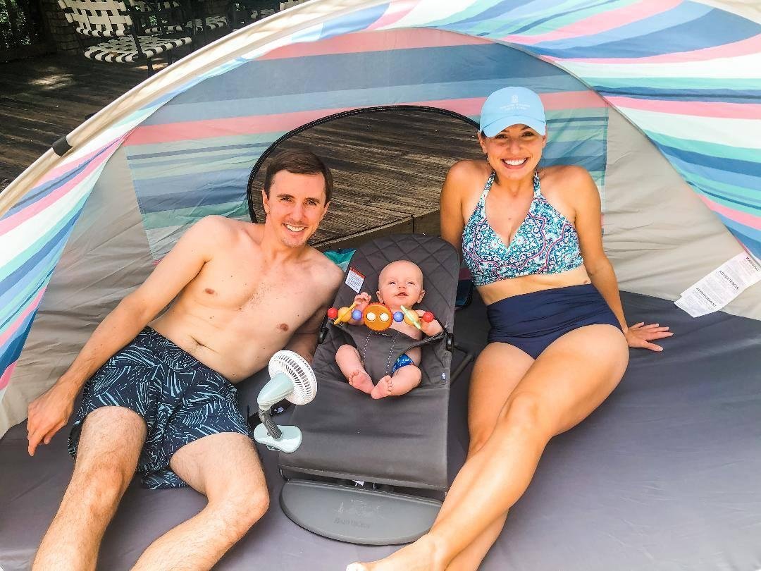 Little Henry enjoys the day poolside with Mom and Dad.