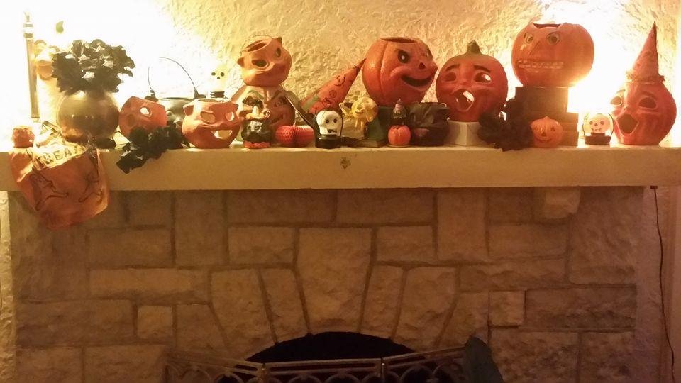 My mantle has been covered with vintage Halloween (paper mache pumpkins and cats) for a month now. Time to pack them away and bring out chalkware Santas.