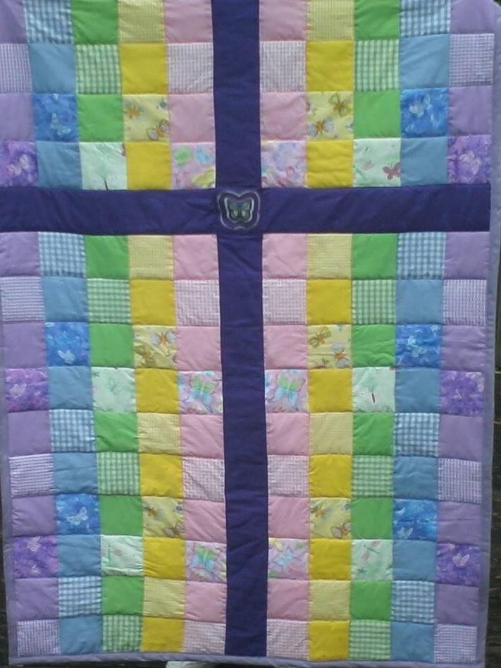 Last summer I made this nursery quilt for a young couple (friends & coworkers) who were expecting their first baby in August. They are sincere Christians so I designed this theme. It was only after it was almost finis